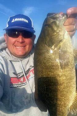 Photo of Kurt Dove and his catch on the St. Lawrence River